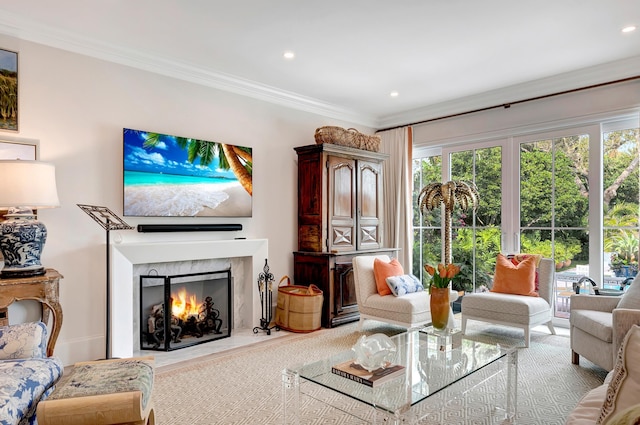 living room featuring crown molding and a high end fireplace