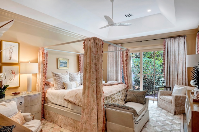 bedroom featuring ceiling fan and a tray ceiling