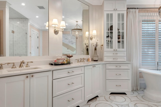 bathroom with vanity, shower with separate bathtub, tile patterned floors, and crown molding