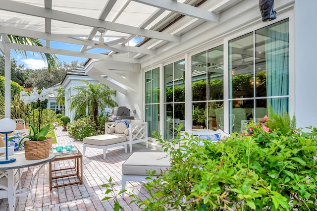 view of patio / terrace featuring a grill and a pergola