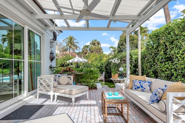 sunroom / solarium featuring ceiling fan and plenty of natural light