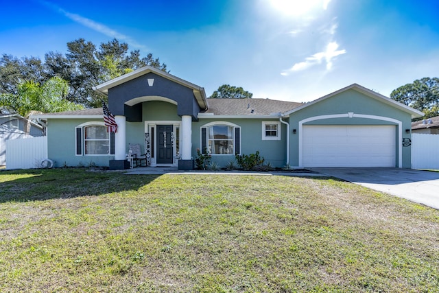 single story home featuring a garage and a front lawn