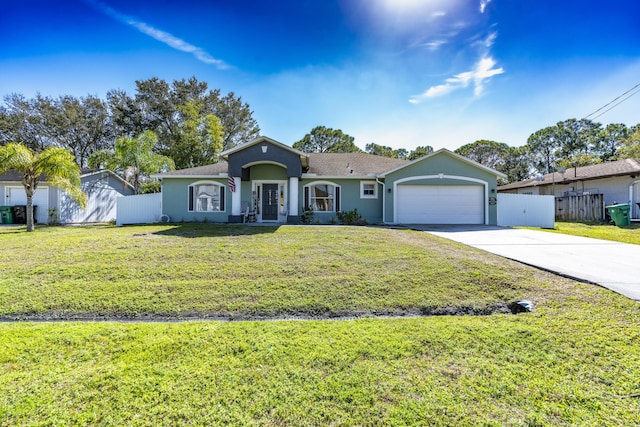 ranch-style house featuring a garage and a front lawn