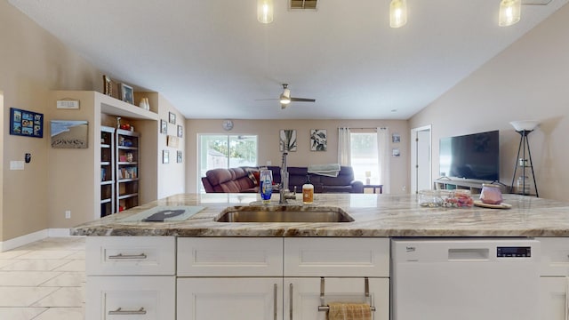 kitchen featuring sink, ceiling fan, white dishwasher, light stone counters, and white cabinets