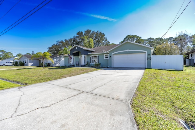 ranch-style house featuring a garage, central AC, and a front lawn