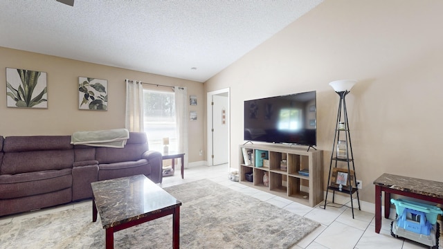 tiled living room with lofted ceiling and a textured ceiling