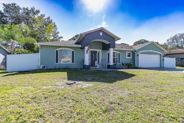 view of front of house featuring a garage and a front yard