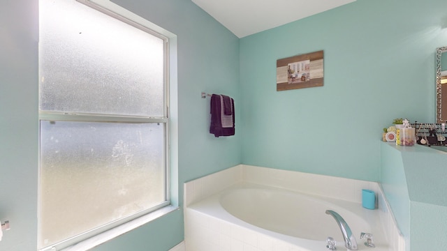 bathroom with tiled bath