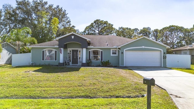 ranch-style house featuring a garage and a front lawn