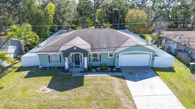 view of front facade featuring a garage and a front yard