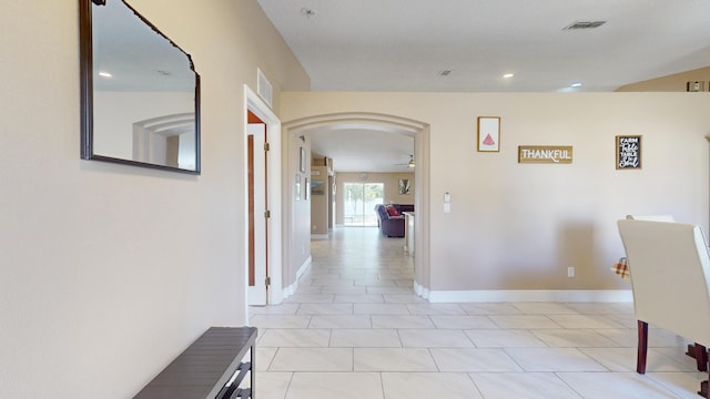 hallway with light tile patterned floors