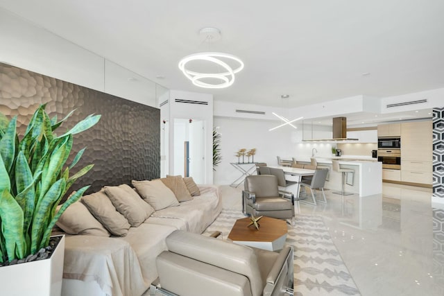 living room featuring an inviting chandelier