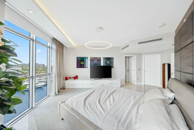 bedroom featuring floor to ceiling windows