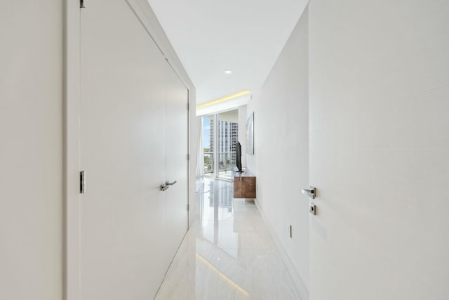 corridor with floor to ceiling windows