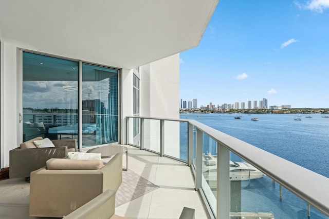 balcony featuring a water view