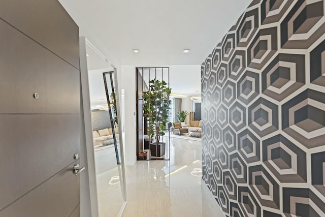 hall with light tile patterned floors