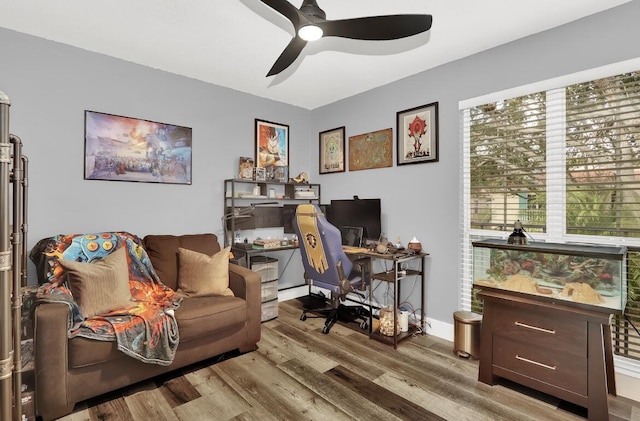 office space featuring wood-type flooring and ceiling fan