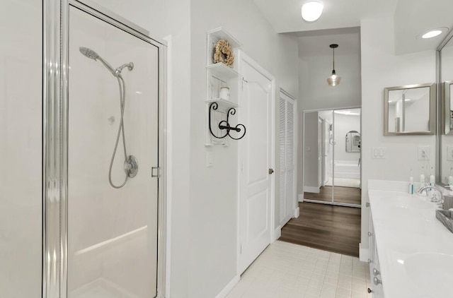 bathroom featuring vanity and an enclosed shower