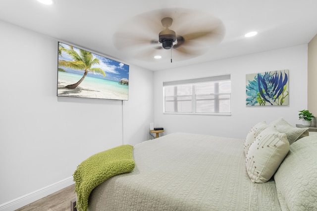 bedroom featuring hardwood / wood-style flooring and ceiling fan