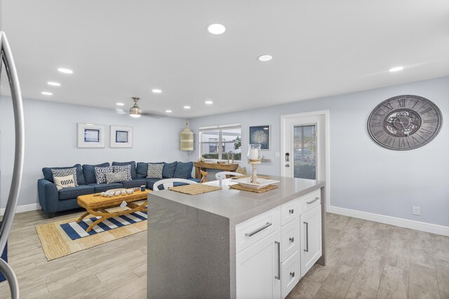 kitchen with backsplash, appliances with stainless steel finishes, sink, and white cabinets