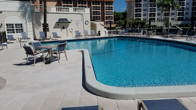 view of swimming pool with a patio area