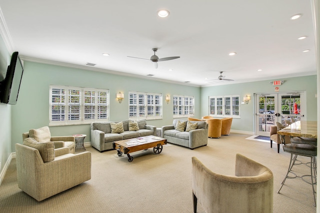 living room featuring crown molding, light colored carpet, french doors, and ceiling fan