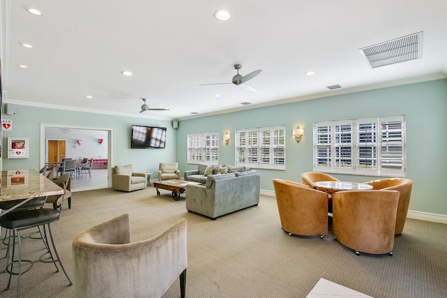 living room featuring light carpet, crown molding, and ceiling fan