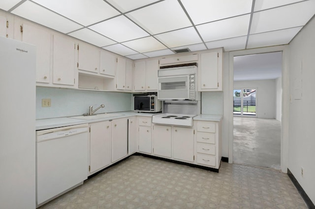 2871 N Ocean Blvd Unit C103, Boca Raton, FL 33431 - kitchen with white appliances, a sink, light countertops, a paneled ceiling, and light floors