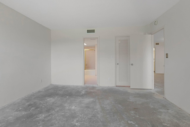 2871 N Ocean Blvd Unit C103, Boca Raton, FL 33431 - unfurnished bedroom featuring carpet, ensuite bath, and a closet