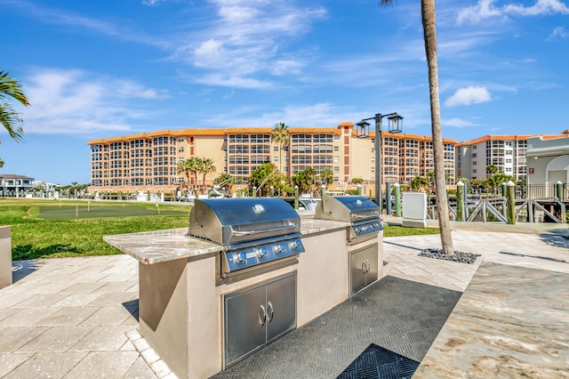 2871 N Ocean Blvd Unit C103, Boca Raton, FL 33431 - view of patio featuring area for grilling and an area to practice putting