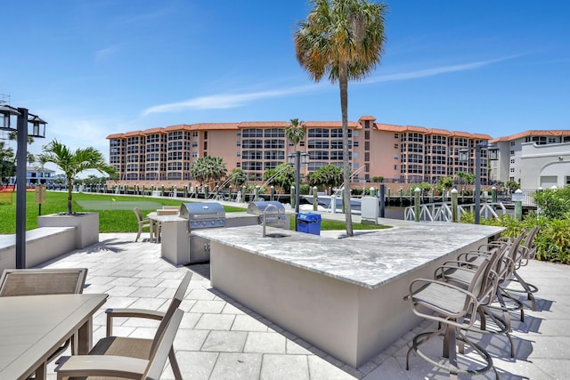2871 N Ocean Blvd Unit C103, Boca Raton, FL 33431 - view of patio with grilling area and exterior kitchen