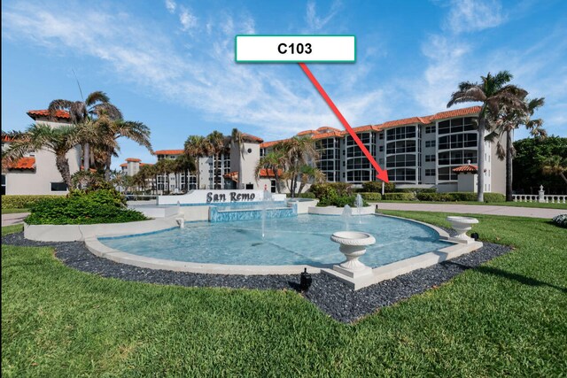 2871 N Ocean Blvd Unit C103, Boca Raton, FL 33431 - view of swimming pool featuring a yard