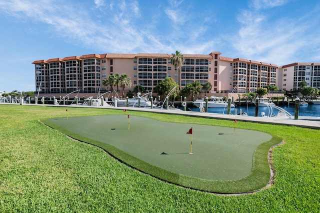 2871 N Ocean Blvd Unit C103, Boca Raton, FL 33431 - view of home's community with an area to practice putting, a yard, and a water view