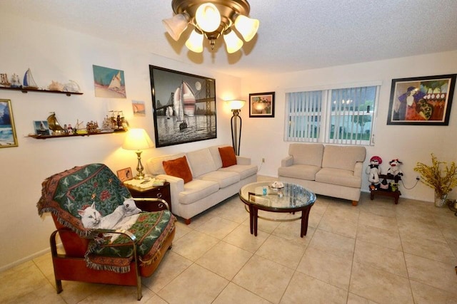 tiled living room with ceiling fan and a textured ceiling