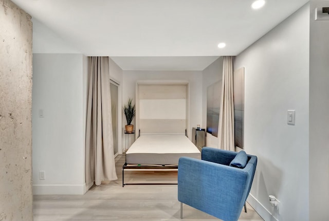 bedroom with light hardwood / wood-style flooring