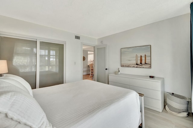 bedroom with light hardwood / wood-style flooring