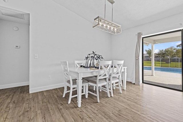 dining room with wood-type flooring