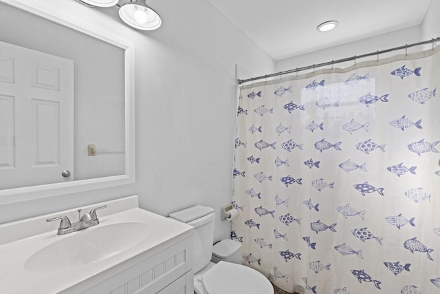 bathroom with vanity, toilet, and a shower with shower curtain