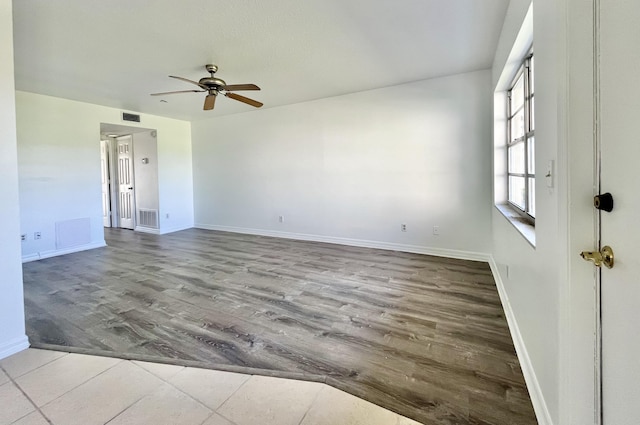 spare room with light hardwood / wood-style flooring and ceiling fan