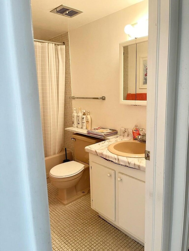 full bathroom with vanity, shower / bath combo, tile patterned floors, and toilet