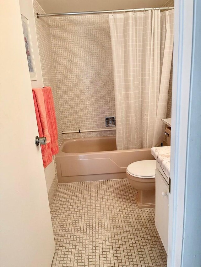 full bathroom with vanity, toilet, tile patterned flooring, and shower / bath combo