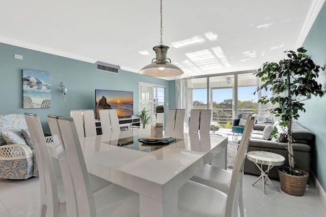 dining space featuring ornamental molding