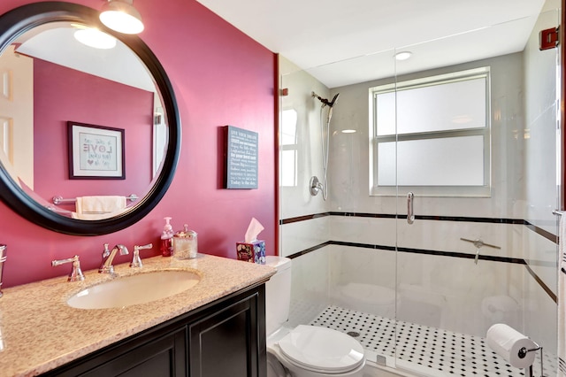 bathroom with vanity, toilet, and walk in shower