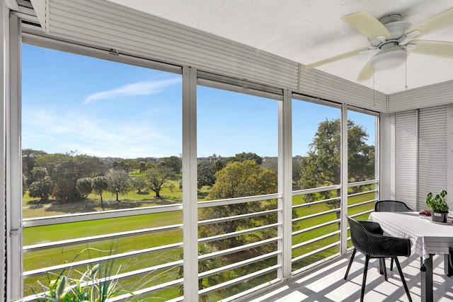 sunroom / solarium with ceiling fan