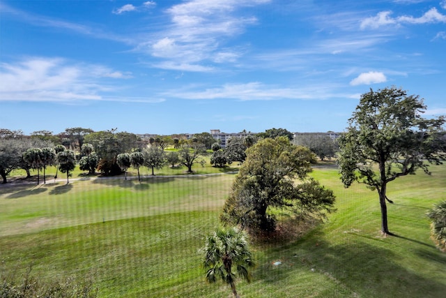 view of property's community featuring a water view and a lawn