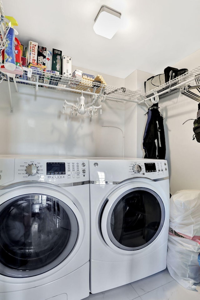 clothes washing area with washer and dryer