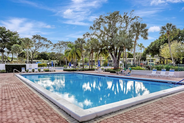 view of swimming pool with a patio area