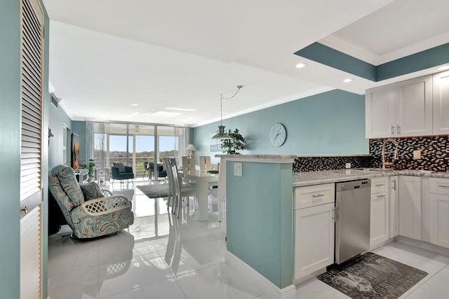 kitchen with dishwasher, backsplash, hanging light fixtures, ornamental molding, and white cabinets