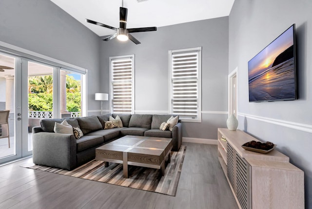 living room with ceiling fan and light wood-type flooring