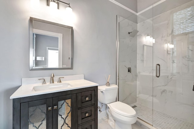 bathroom featuring walk in shower, vanity, and toilet